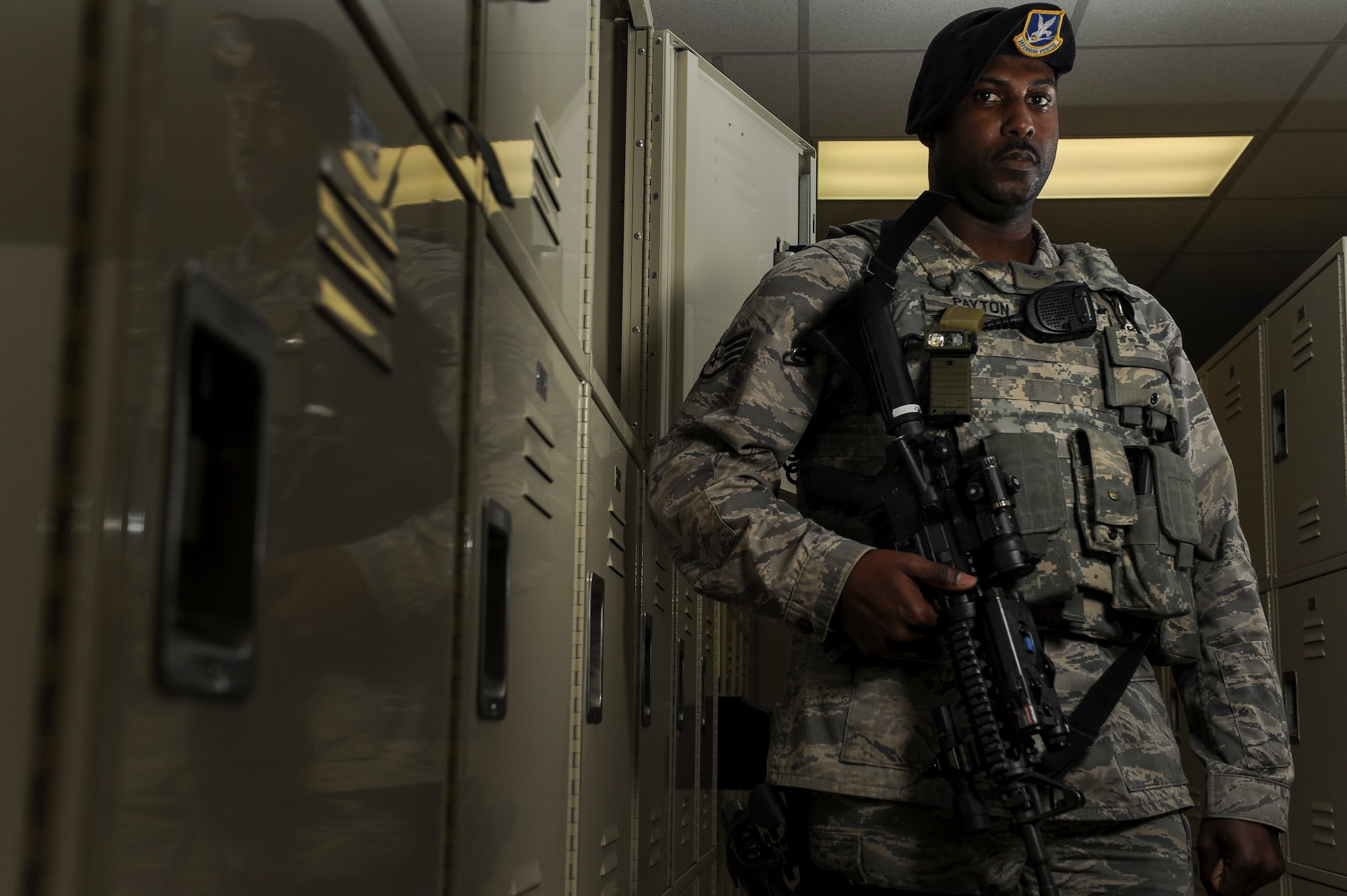 Staff Sgt. William Payton, a 19th Security Forces Squadron patrolman, suits up before guard mount Feb. 25, 2015, at Little Rock Air Force Base, Ark. Payton, a Holly Springs, Miss., native was selected as the Combat Airlifter of the Week for his superior attention to detail when stopping an unauthorized vehicle from gaining access to the base. (U.S. Air Force photo/Senior Airman Cliffton Dolezal)
