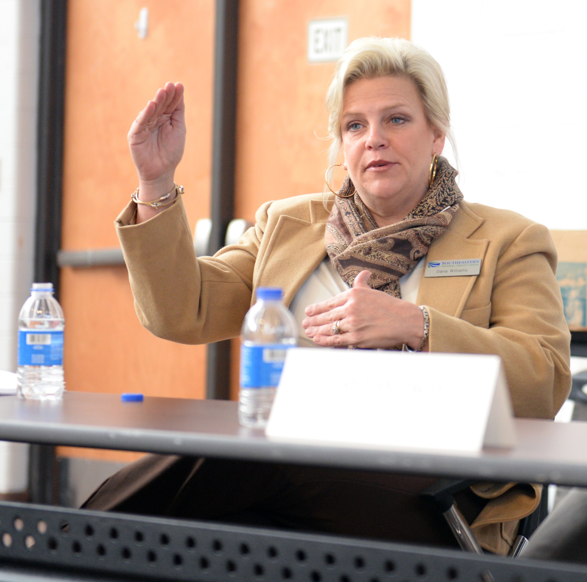 Dana Williams, Southeastern Federal Credit Union mortgage loan officer, explains the preferred credit scores for purchasing homes and approving loans at the Home Buying and Selling Seminar Feb. 18, 2015, at Moody Air Force Base, Ga.  Williams also explained how to establish credit for those who don’t have any. (U.S. Air Force photo by Airman Greg Nash/Released) 
