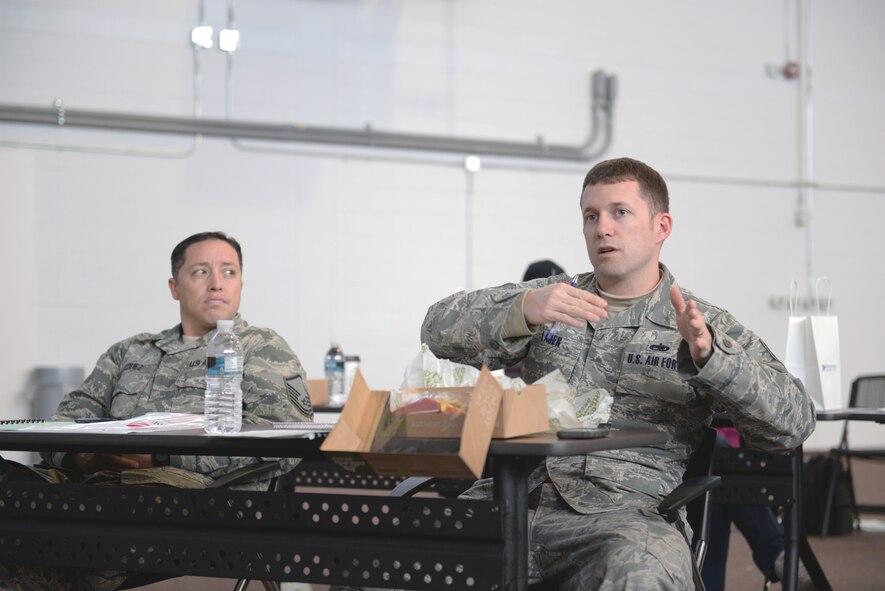 U.S. Air Force Tech. Sgt. Christopher Lauer, 23d Equipment Maintenance Squadron aircraft metals technology craftsman, right, asks about assessing pre-owned homes at the Home Buying and Selling Seminar Feb. 18, 2015, at Moody Air Force Base, Ga.  Attendees were allotted time for a question and answer forum with local community home expert panelists. (U.S. Air Force photo by Airman Greg Nash/Released)