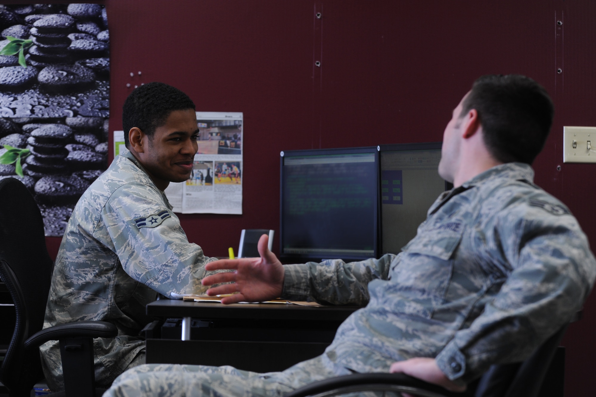 Airman 1st Class Jalen Ellingberg, a 19th Comptroller Squadron financial management specialist, shares a laugh with a fellow Airman on Feb. 24, 2014, at Little Rock Air Force Base, Ark. Ellingberg says he loves the military. It is a community in which he feels accepted. (U.S. Air Force photo/Senior Airman Cliffton Dolezal)
