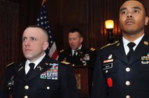 Maj. Francisco S. Junkin, 56th Stryker Brigade Combat Team operations officer, Reading, Pennsylvania and Staff Sgt. Melvyn L. Mayo Jr., Medical Battalion Training Site instructor, Fort Indiantown Gap, Pennsylvania, both  from the Pennsylvania National Guard, stand at attention while accepting  the Major Octavius V. Catto Medal Feb. 21, 2015, at The Union League of Philadelphia, Philadelphia, Pennsylvania. The award bears the name of the Civil War-era African American leader and civil rights martyr from Philadelphia and is awarded to Guardsmen who display exemplary service and community support. (U.S. Air National Guard photo by Tech. Sgt. Andria J. Allmond/Released)

