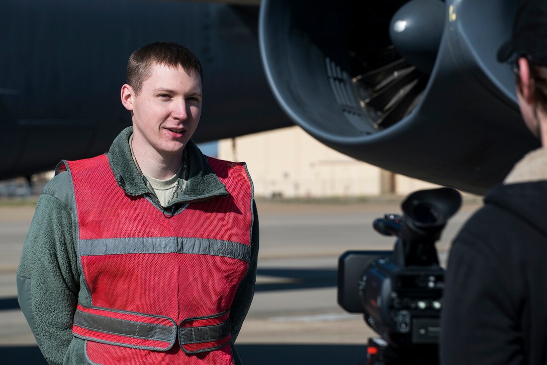 U.S. Air Force Senior Airman Justin Robinson, 307th Aircraft Maintenance Squadron crew chief, is interviewed during a photo shoot on Feb. 7, 2015, Barksdale Air Force Base, La. The RCP Photography team visited the Air Force Reserve Command's 307th Bomb Wing during the February Unit Training Assembly to take video and photos of Airmen in their work environments which will be used for recruiting purposes. (U.S. Air Force photo by Master Sgt. Greg Steele/Released)