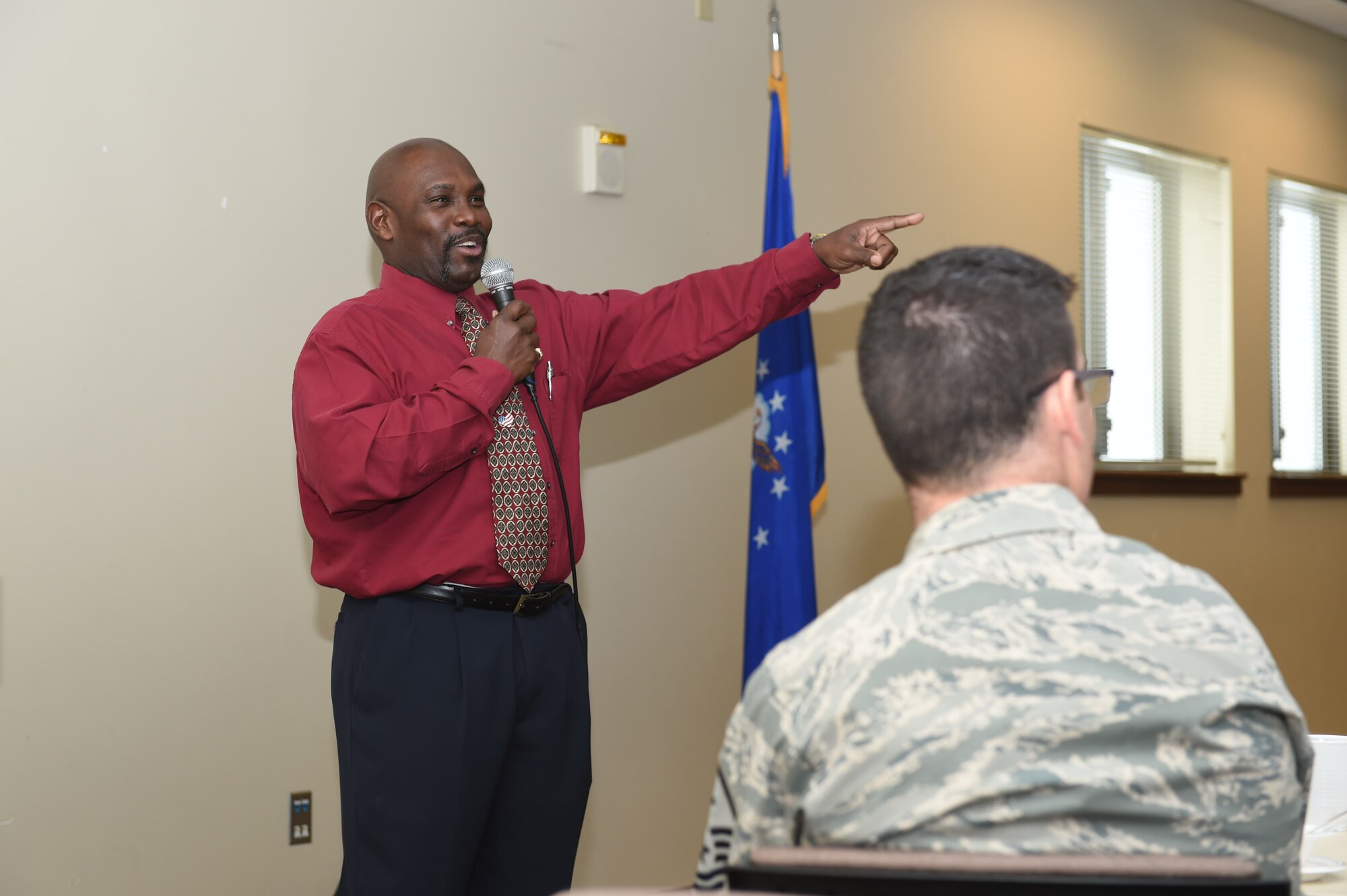 Vern L. Howard, Martin Luther King Jr. Colorado Holiday Commission chairman, speaks to Team Buckley members during a Black History Month presentation Feb. 26, 2015 at the chapel on Buckley Air Force Base, Colo. Howard spoke on the contributions African-Americans have made in American history while attendees sampled cultural dishes. (U.S. Air Force photo by Airman 1st Class Samantha Saulsbury/Released)