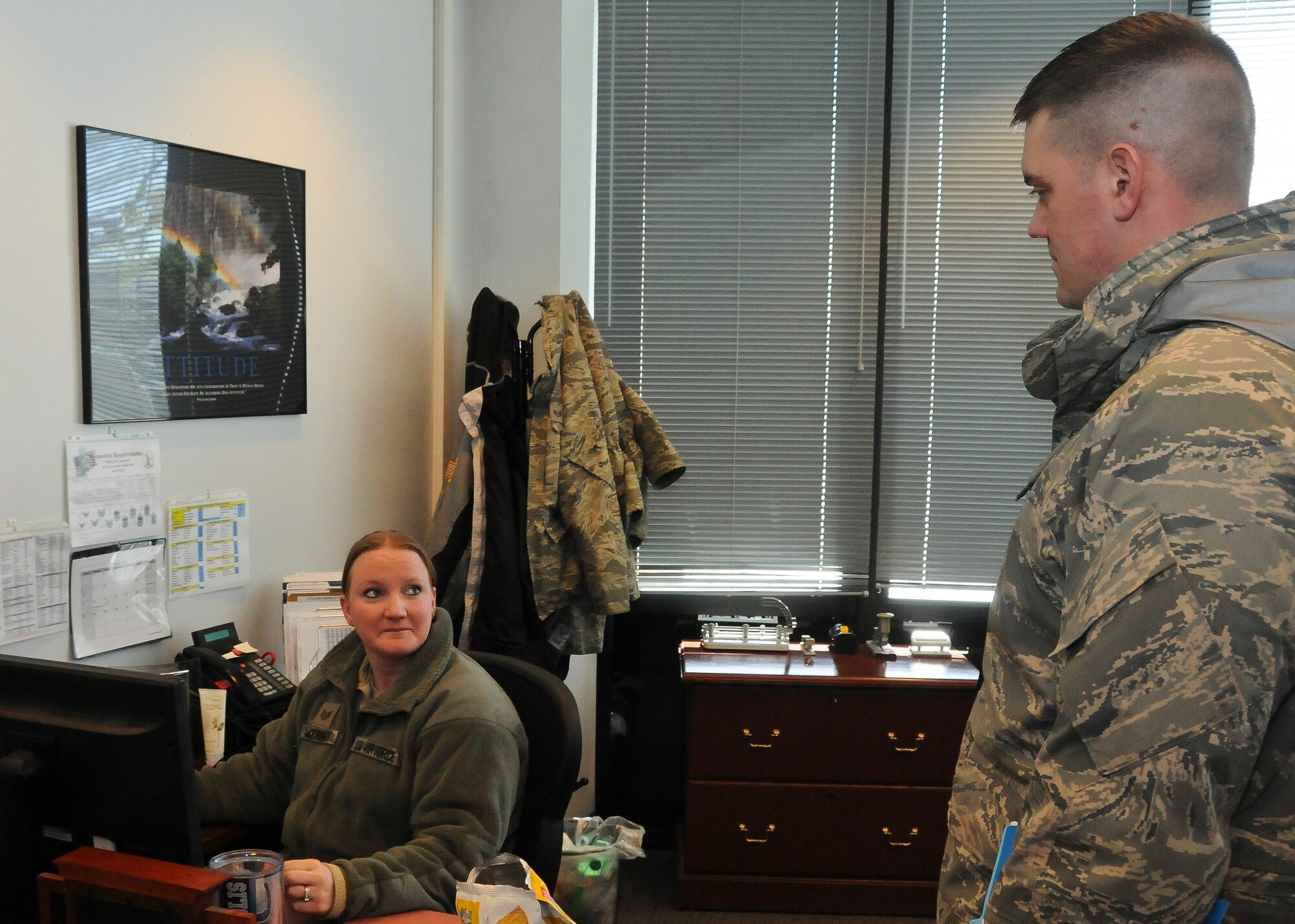 Master Sgt. Jason Mundt, 114th Inspector General program manager, questions Staff Sgt. Staci McKinney, 114th Logistics Readiness Squadron administrative support technician, about the Integrated Defense Exercise held at Joe Foss Field, Feb. 26, 2015. The IDE challenged the 114th Fighter Wing personnel on how they would react to a real world terrorist attack in the U.S. (National Guard photo by Staff Sgt. Luke Olson/Released)