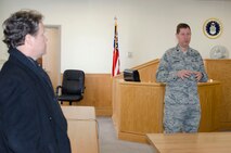 John Paradee, a civilian attorney and honorary commander for the 512th Airlift Wing commander, listens to a military justice briefing from Lt. Col. Scott Boehne, a 436th Airlift Wing staff judge advocate, inside the courtroom on Dover Air Force Base, Del., Feb. 25, 2015. Paradee and other Team Dover honorary commanders visited the base as part of the Honorary Commander 101 Briefing and Wing Staff Agency Tour. (U.S. Air Force photo/Master Sgt. Veronica Aceveda)