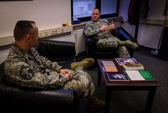 Master Sgt. Etienne Tousignant, 786th Force Support Squadron career assistance advisor, mentors a wingman at Ramstein Air Base, Germany, Feb. 11, 2015. After a path on a downward spiral, Tousignant was able to use his life experiences as an example of resilience and set his wingmen on the right path as a career advisor. (U.S. Air Force photo/Senior Airman Nicole Sikorski)