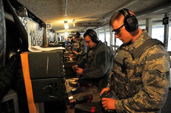 U.S. Air Force Airman 1st Class Henry Sorenson, 509th Security Forces Squadron member, loads an M4 magazine during a combat arms training and maintenance course at Whiteman Air Force Base, Mo., Feb. 10, 2015. Prior to joining the Air Force, Sorenson embarked on a two-year mission trip to Brazil where he became fluent in Portuguese. (U.S. Air Force photo by Senior Airman Keenan Berry/Released)  