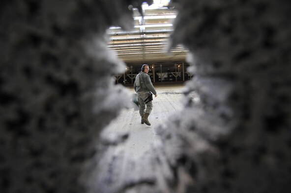 U.S. Air Force Airman 1st Class Henry Sorenson, 509th Security Forces Squadron member, walks away from a firing target during a combat arms training and maintenance course at Whiteman Air Force Base, Mo., Feb. 10, 2015. Sorenson is from Cedar City, Utah, and was raised as a member of the Church of Jesus Christ of Latter-day Saints. He was chosen to serve a mission in Brazil for two years before joining the Air Force. (U.S. Air Force photo by Senior Airman Keenan Berry/Released)