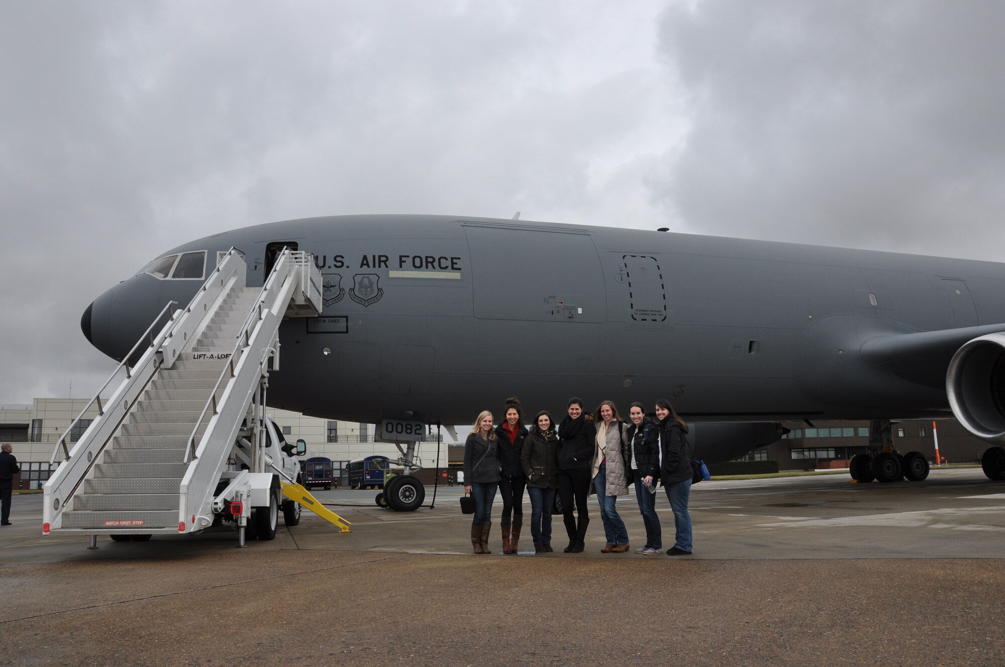 Spouses from the 48th Fighter Wing pose in front of a KC-10 Extender after participating in a spouse flight over the North Sea, Feb. 20. The event gives spouses an opportunity to witness a refueling mission firsthand and to give them a better understanding of the jobs their loved ones perform on a regular basis. 
