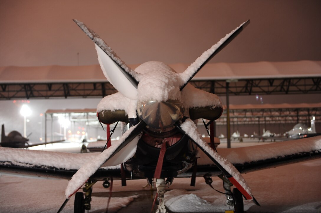 One of the100 Columbus AFB T-6 Texans weathered the 2 day sleet and snow storm Feb. 25. The base was closed Feb. 25-26 as more than 5 inches of snow were recorded on the base.(U.S. Air Force photo/Airman Daniel Lile)