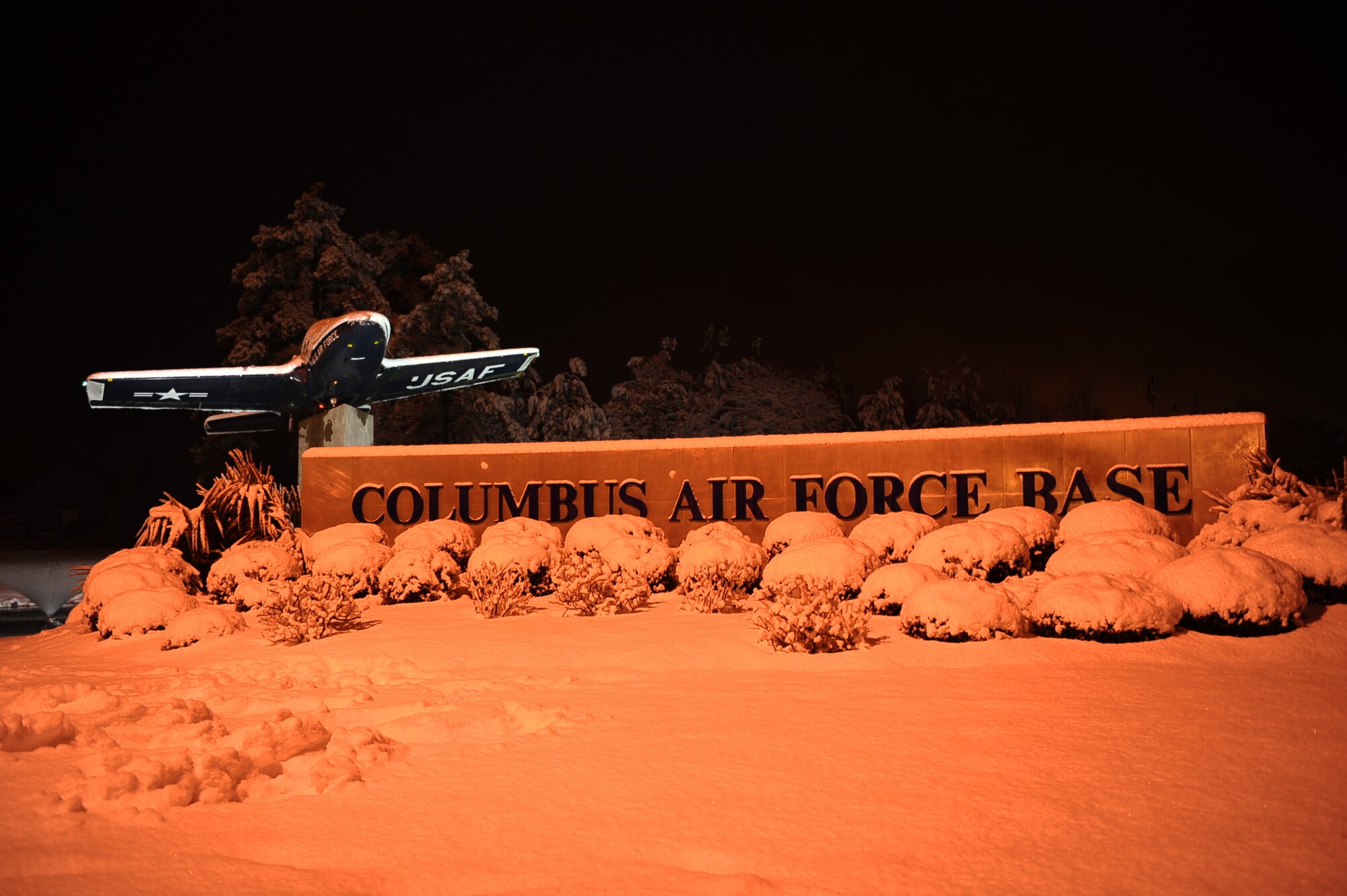 The Columbus Air Force Base welcome sign on Highway 45 sits covered in snow Feb. 25. The base was closed Feb. 25-26 as more than 5 inches of snow were recorded on the base.(U.S. Air Force photo/Airman Daniel Lile)
