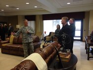 Chaplain (Lt. Col.) James Parrish, 436th Airlift Wing chaplain, explains to Kevin Phillipson, 512th Maintenance Group honorary commander, how the base chapel was built with an annex to support the Air Force Mortuary Affairs Operations' mission and accommodate additional family members during a mass fatality.  Phillipson is one of about 30 Team Dover honorary commanders who attended the half-day event, Feb. 25, 2015 at Dover Air Force Base, Del., where they also visited the command post and the legal and safety offices. (U.S. Air Force photo/Master Sgt. Veronica Aceveda)
