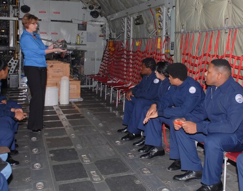 A group of ROTC cadets from Charles Drew High School in Clayton County sits in the C-130 to get a closer look at the aircraft’s capabilities. James provided the students with the history of the aircraft and discussed its usefulness.  (U.S. Air Force photo by Misuzu Allen)