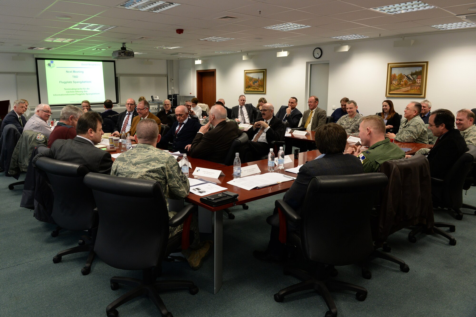 Leaders of the 52nd Fighter Wing and local community engage in an information forum Feb. 20, 2015, at Spangdahlem Air Base, Germany. The forum aimed to strengthen the partnership between Germany and the U.S. by updating local community leaders about upcoming base projects, issues and a question-and-answer portion. (U.S. Air Force photo by Senior Airman Dylan Nuckolls/Released)