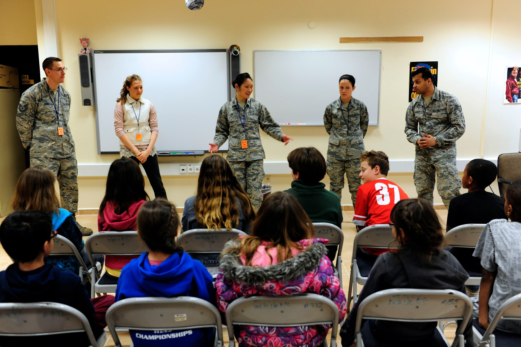 Volunteers from the 39th Medical Operations Squadron and American Red Cross speak to a class of fourth-grade students at the Incirlik Unit School Feb. 24, 2015, at Incirlik Air Base, Turkey. As part of National Children’s Dental Health Month volunteers taught the students about proper dental health. (U.S. Air Force photo by Senior Airman Krystal Ardrey/Released)