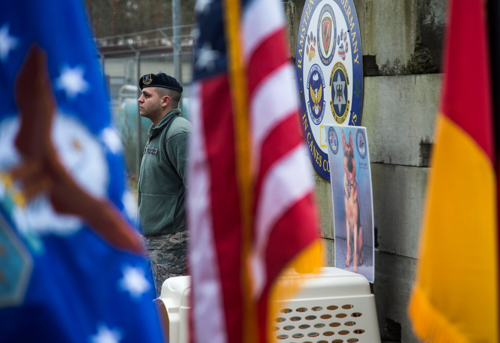 Staff Sgt. Andres Posada, 86th Security Forces Squadron K-9 handler, stands next to an empty kennel during a memorial service held for his military working dog, Sano, at Ramstein Air Base, Germany, Feb. 24, 2015. Posada and Sano worked together for seven years as an explosive ordnance detection team. Sano deployed to Qatar, Iraq, and United Arab Emirates. He also supported the United States Secret Service on 12 distinguished visitor visits, including the President and Vice president of the United States, all over the European area of responsibility. (U.S. Air Force photo/Senior Airman Damon Kasberg)