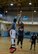 Coury Ellison, 51st Security Forces Squadron, shoots the ball over a 51st Force Support Squadron defender during the first half of an intramural basketball game Feb. 24, 2015, at Osan Air Base, Republic of Korea. Ellison made the basket giving SFS their first points of the game. (U.S. Air Force photo by Senior Airman David Owsianka)
