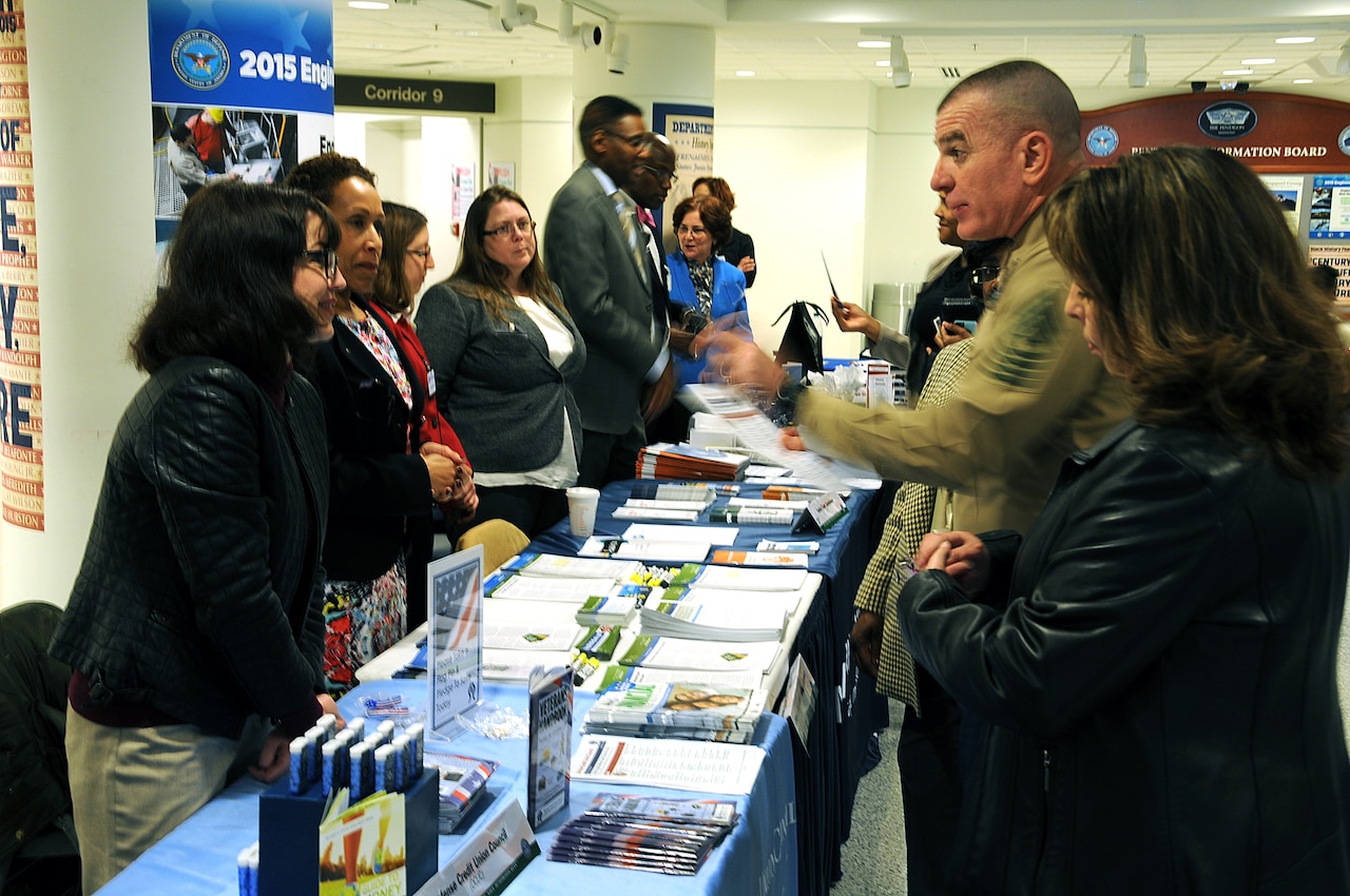 Marine Corps Sgt. Maj. Bryan Battaglia, senior enlisted advisor to the Chairman of the Joint Chiefs of Staff, and his wife, Lisa, visited the 2015 Military Saves Week Financial Fair at the Pentagon, Feb. 24, 2015. The annual fair is a  social marketing campaign to persuade, motivate and encourage military families to save money every month. DoD photos by Anthony Steele