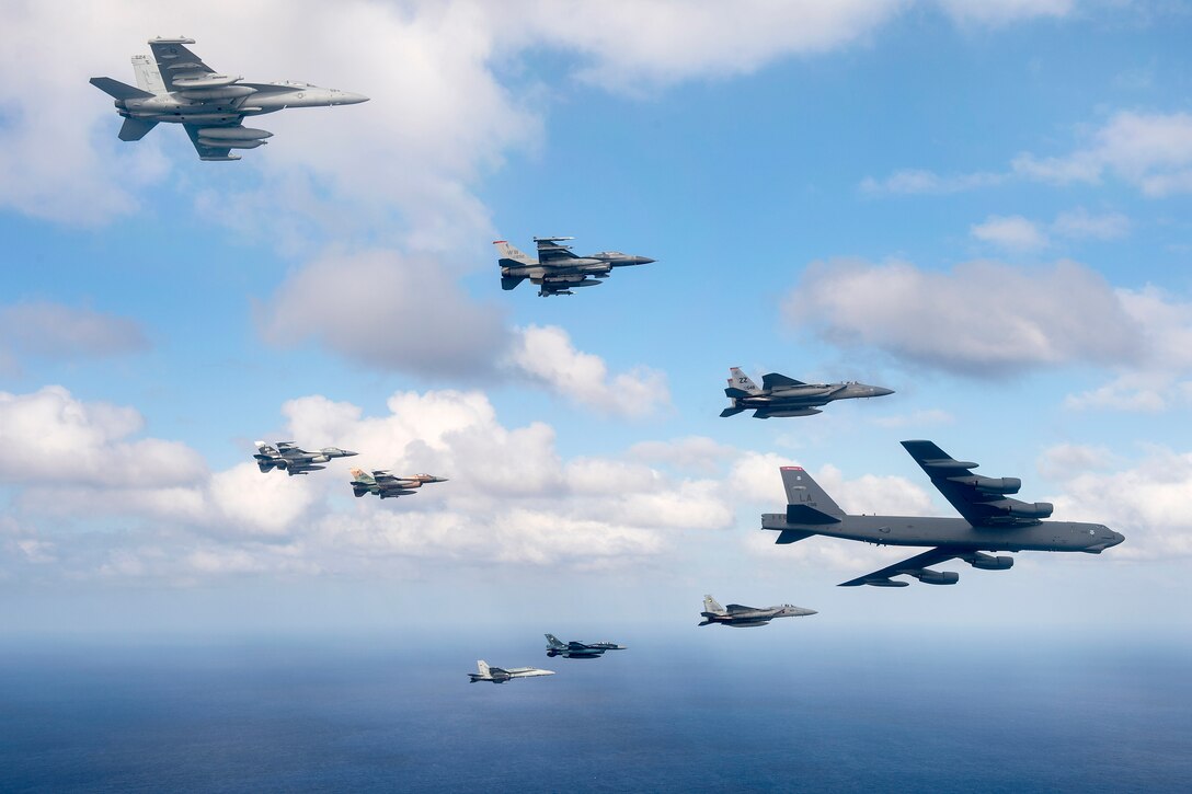 U.S., Japanese and Australian military aircraft fly in formation during Cope North 15 off the coast of Guam, Feb. 17, 2015.
