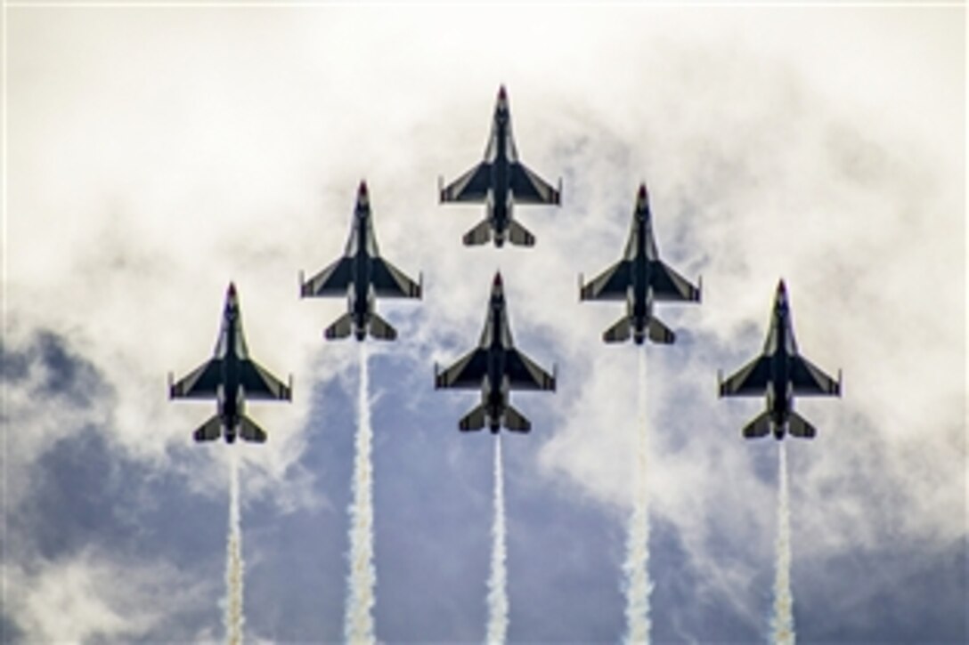 Members of the Thunderbirds, the Air Force's aerial demonstration team, perform the delta formation over Daytona International Speedway during a practice flight in Daytona Beach, Fla., Feb. 21, 2015.