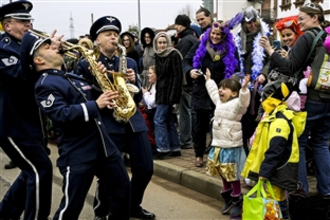 Members of the U.S. Air Forces in Europe Band interact with the crowd during the Fasching parade in Ramstein-Miesenbach, Germany, Feb. 17, 2015. The band and about 1,400 other participants marched in the parade for more than two hours entertaining the crowd. 

