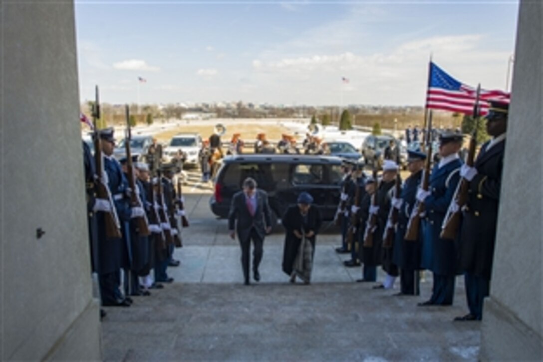 U.S. Defense Secretary Ash Carter hosts an honor cordon for Liberian President Ellen Johnson Sirleaf at the Pentagon, Feb. 25, 2015. The two leaders met to discuss matters of mutual importance, including the U.S. response to the Ebola virus outbreak in West Africa.