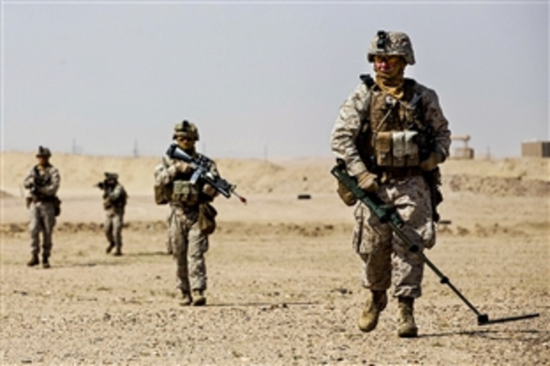 U.S. Marine Corps Lance Cpl. Mike Leatherman checks for improvised explosive devices while leading a patrol during a training exercise at Udairi Range, Kuwait, Feb. 22, 2015. Leatherman is a combat engineer assigned to India Company, Battalion Landing Team 3rd Battalion, 6th Marine Regiment, 24th Marine Expeditionary Unit.