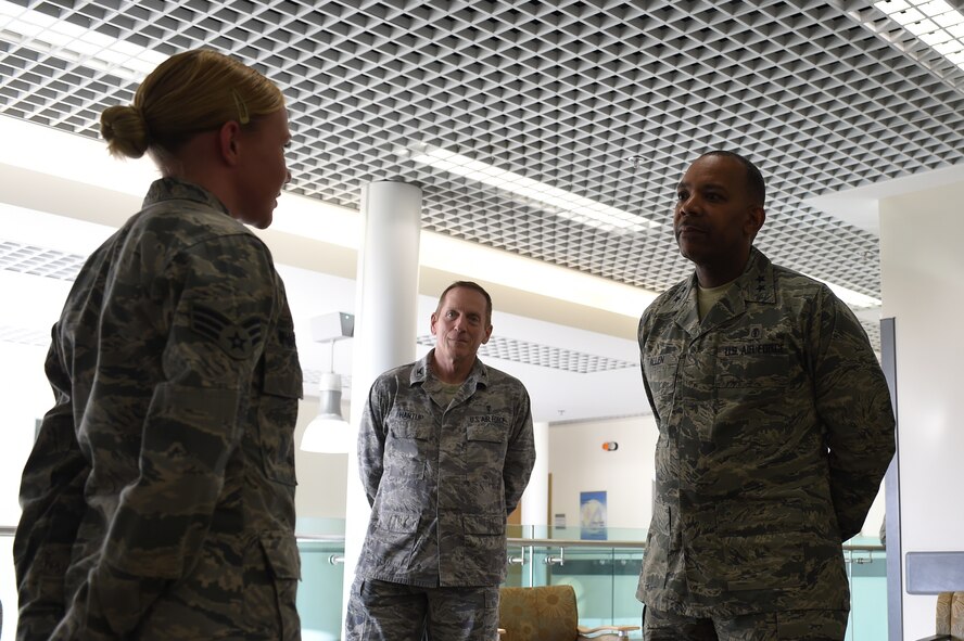 Senior Airman Kaitlin Wharton, 422nd Medical Squadron dental assistant, left, briefs Maj. Gen. Roosevelt Allen, U.S. Air Force Dental Service assistant surgeon general, during his visit to RAF Alconbury, England, Feb. 17, 2015. Throughout the visit, Allen discussed his strategic vision for the Dental Service, and how Airmen of the 501st Combat Support Wing can help implement it. (U.S. Air Force photo by Staff Sgt. Jarad A. Denton/Released)