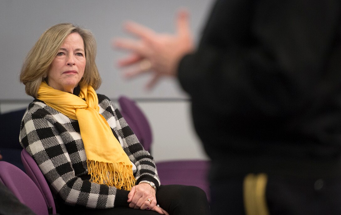 Deanie Dempsey, wife of Army Gen. Martin E. Dempsey, chairman of the Joint Chiefs of Staff, listens as the chairman speaks with students and spouses attending a Capstone course at the National Defense University on Fort Lesley J. McNair in Washington, D.C., Feb., 27, 2015. 