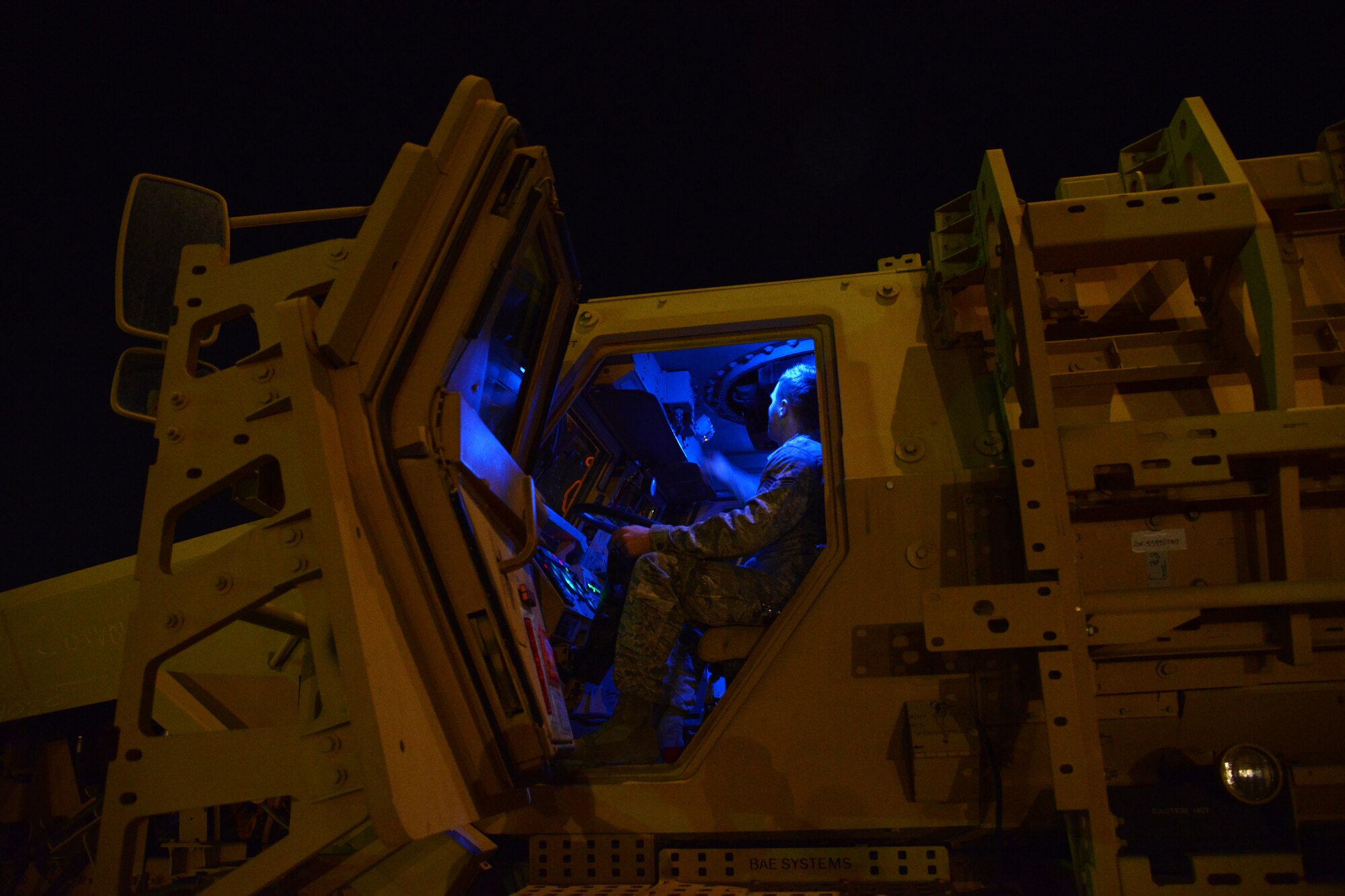 Airmen from the 386th Expeditionary Operations Group and the 386th Expeditionary Logistics Readiness Squadron, load two Mine Resistant Armored Personnel carriers on a C-17 Globemaster III bound for Erbil, Iraq, Dec. 30, 2014. The MRAPs are for the Iraqi Security Forces and Peshmerga to aid in the fight against Daish. (U.S. Air Force photo by Tech. Sgt. Jared Marquis)