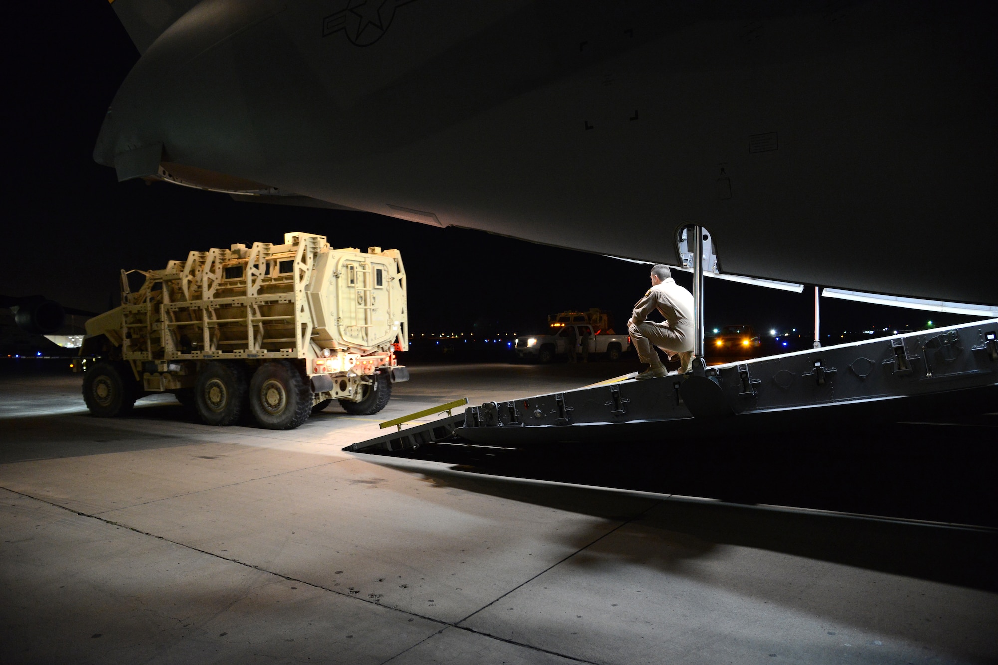 Airmen from the 386th Expeditionary Operations Group and the 386th Expeditionary Logistics Readiness Squadron, load two Mine Resistant Armored Personnel carriers on a C-17 Globemaster III bound for Erbil, Iraq, Dec. 30, 2014.The MRAPs are for the Iraqi Security Forces and Peshmerga to aid in the fight against Daish. (U.S. Air Force photo by Tech. Sgt. Jared Marquis)