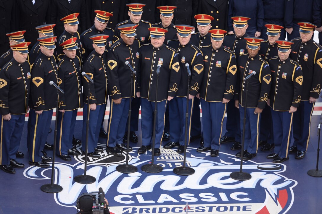 The U.S. Army Chorus performs during the 2015 Bridgestone NHL Winter Classic hockey game between the Washington Capitals and Chicago Blackhawks in Nationals Park, Washington, D.C., Jan. 1, 2015. 