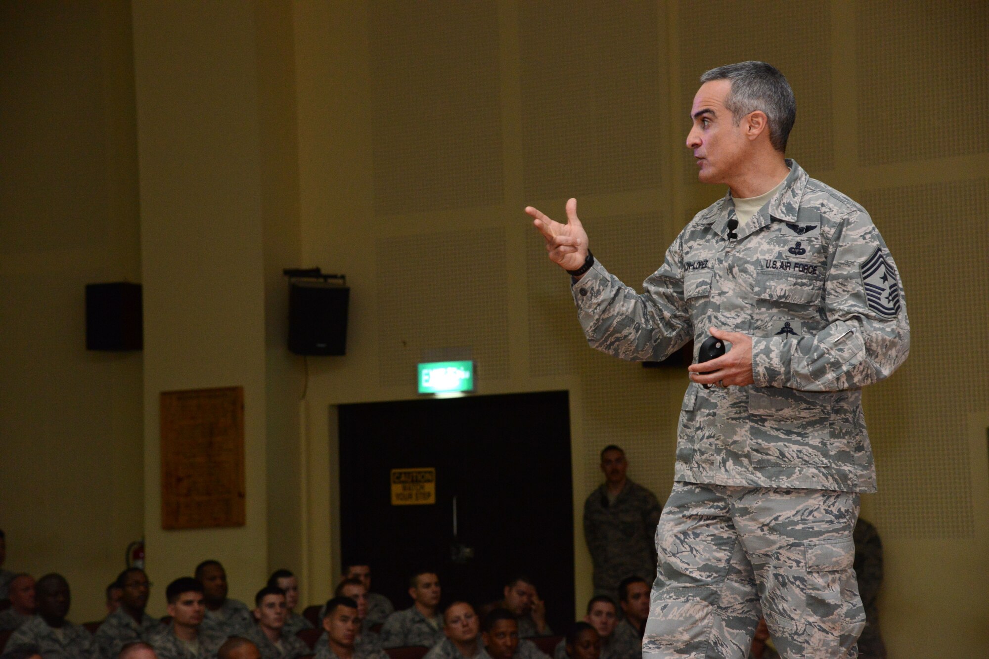 Chief Master Sgt. Ramon Colon-Lopez, U.S. Air Forces Central Command command chief, talks to Airmen from the 386th Air Expeditionary Wing during an enlisted all call Dec. 29, 2014. Colon-Lopez talked about the new evaluation system and the importance of rating everyone accurately. (U.S. Air Force photo by Tech. Sgt. Jared Marquis/released)