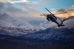 An HH-60 Pave Hawk helicopter from the 210th Rescue Squadron, Alaska Air National Guard, practices “touch and go” maneuvers at Bryant Army Airfield on Joint Base Elmendorf-Richardson, Dec. 17, 2014. A similar helicopter helped rescue a stranded hunter, whose snowmobile broke down on Dec. 29.