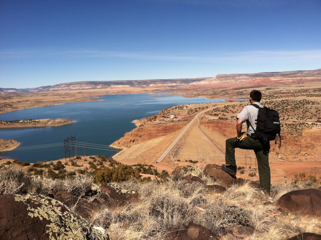 2014 District Photo Drive entry. Photo by Austin Kuhlman, March 9, 2014.  “Abiquiu Park Ranger Nathaniel Naranjo inspects fence line above Abiquiu Dam.”