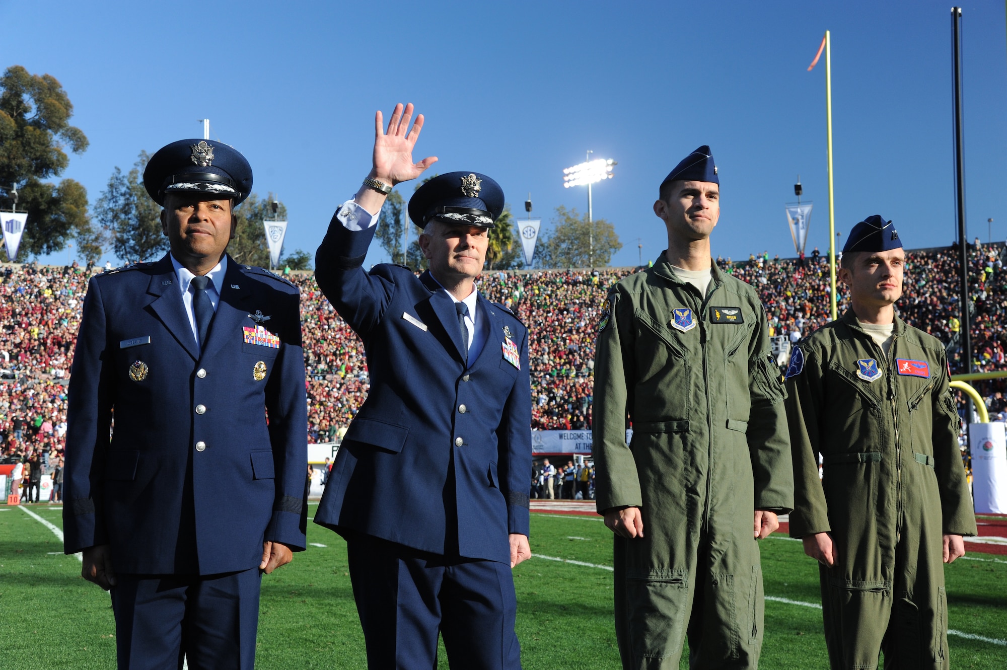 From left to right: Lt. Gen. Samuel Greaves, commander of Air Force Space Command at Los Angeles Air Force Base, Calif.; Brig. Gen. Glen VanHerck, commander of the 509th Bomb Wing; and Capts. Christopher Conant and Matthew Zulauf, B-2 Spirit stealth bomber pilots, represent the U.S. Air Force at the 101st Rose Bowl Game Jan. 1, 2015, in Pasadena, Calif. The three on the right were from Whiteman Air Force Base, Mo., the home unit of the B-2s that flew over the game and that morning’s 126th annual Tournament of Roses Parade. (U.S. Air Force photo by Staff Sgt. Brigitte N. Brantley/Released)
