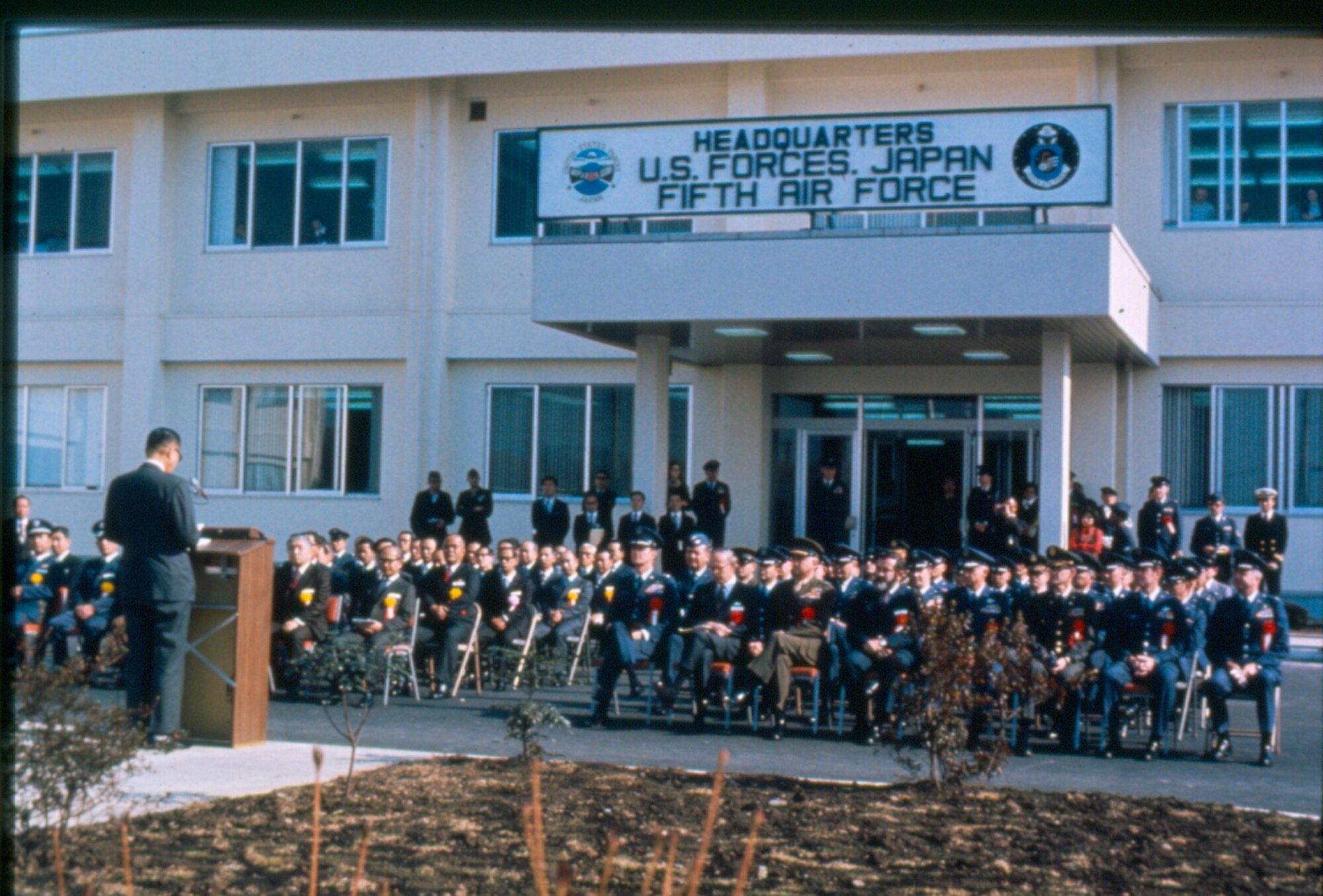 An 11 November 1974 photo of the dedication ceremony of the new 5th Air
Force / US Forces Japan headquarters building at Yokota. 5th Air Force
relocated to Yokota from Fuchu Air Station as part of KPCP. (Photo courtesy of the 374th 
Airlift Wing History Office)
