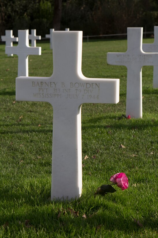 The head stone of Pvt. Barney B. Bowden, the great-uncle of U.S. Marine Corps Cpl. Robert Bowden, an infantryman with SPMAGTF-Crisis Response- Africa, at the Normandy American Cemetery and Memorial, Normandy, France, Dec. 27, 2014. Marines and Sailors from SPMAGTF-Crisis Response-Africa visited Normandy to learn more about the history behind D-Day, including the invasion timeline, tactics, routes used by the soldiers. The cemetery is the final resting place for over nine thousand Americans who sacrificed their lives during the D-Day invasion and the following military operations of World War II. (U.S. Marine Corps photo by Cpl. Jeraco Jenkins/Released).