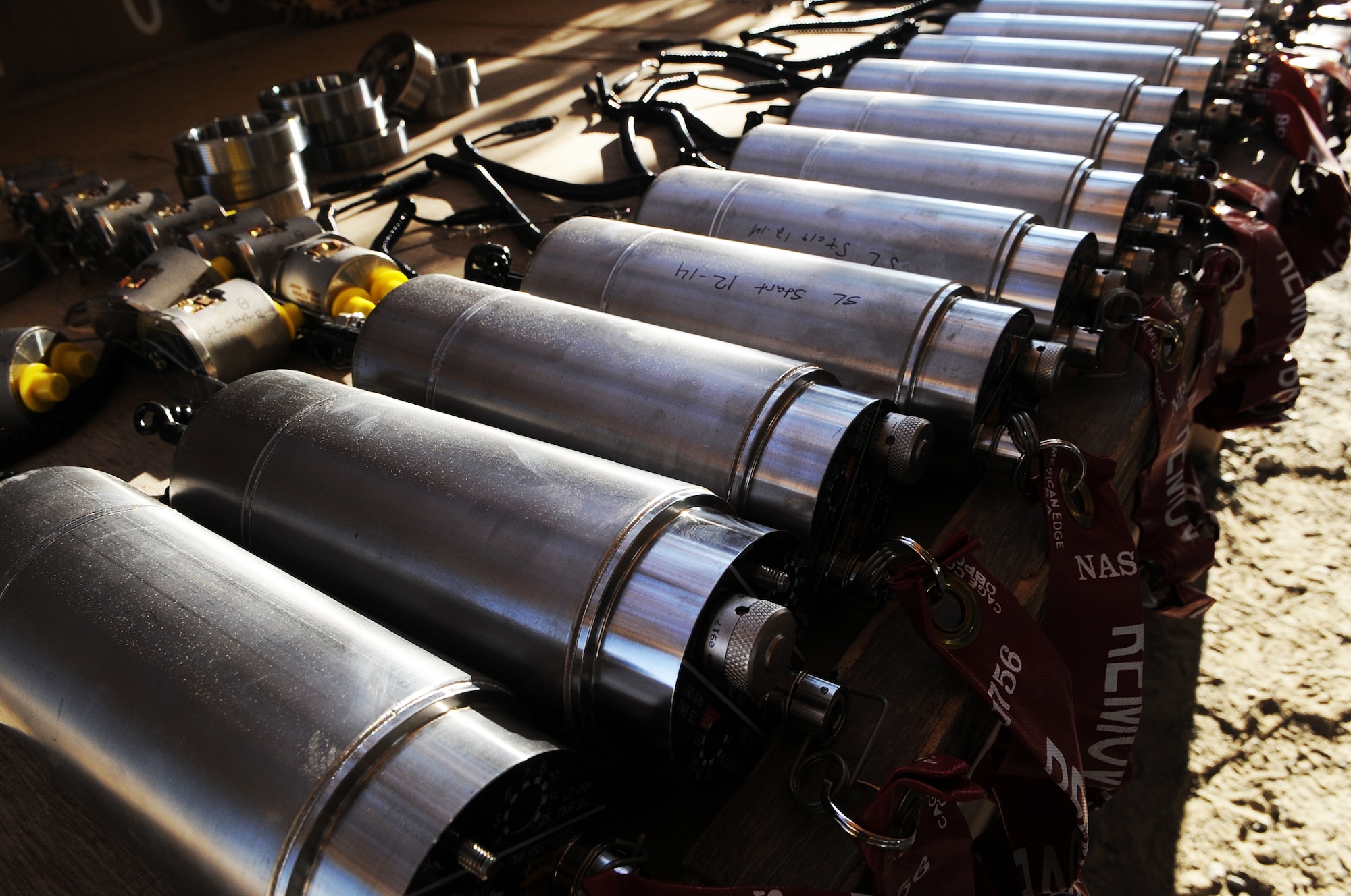 A row of FMU-152 bomb fuzes lay prepped and ready to be installed inside MK-82 munition casings Dec. 21, 2014, in Southwest Asia.  The FMU-152s are the latest type of fuze the Air Force is using when building munitions.  (U.S. Air Force photo/Senior Master Sgt. Carrie Hinson)