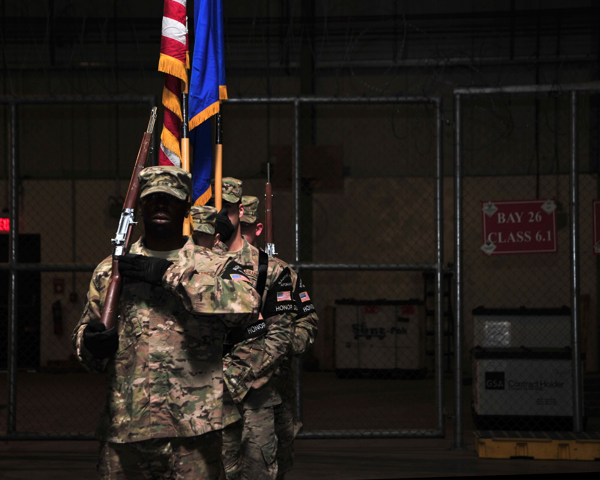 U.S. Air Force Airmen assigned to the 455th Air Expeditionary Wing honor guard team prepare to present the colors during a squadron inactivation ceremony Jan. 1 at Bagram Airfield, Afghanistan. The squadron, now belonging to the 455th Expeditionary Logistics Readiness Squadron, will henceforth be recognized as an aerial port flight. (U.S. Air Force photo by Staff Sgt. Whitney Amstutz/released)