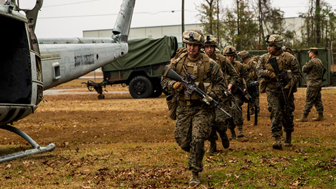 Marines with 2nd Battalion, 8th Marine Regiment practice entering and exiting the MV-22B Osprey during a simulated Tactical Recovery of Aircraft and Personnel, or TRAP, mission aboard Marine Corps Air Station New River, Dec. 9, 2014. The TRAP training provides designated forces tactical training and initial evaluation in order to conduct search and personnel recovery operations for the upcoming deployment with Special-Purpose Marine Air-Ground Task Force Crisis Response-Africa.