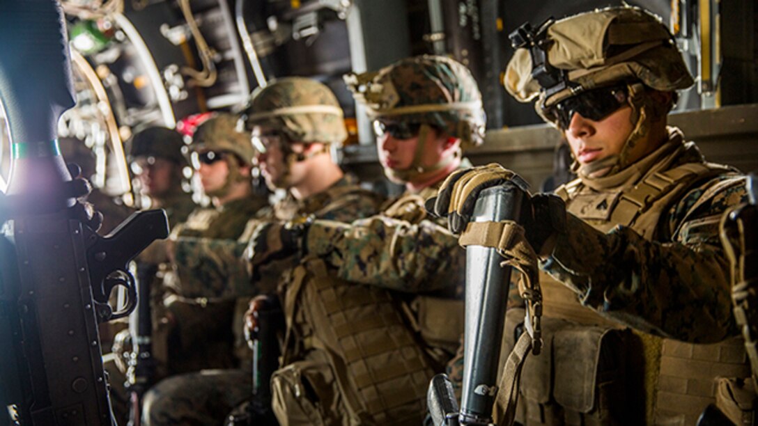 Marines with 2nd Battalion, 8th Marine Regiment ride in an MV-22B Osprey during a simulated Tactical Recovery of Aircraft and Personnel, or TRAP, mission aboard Marine Corps Air Station New River, Dec. 10, 2014. The TRAP training provides designated forces tactical training and initial evaluation in order to conduct search and personnel recovery operations for the upcoming deployment with Special-Purpose Marine Air-Ground Task Force Crisis Response-Africa.