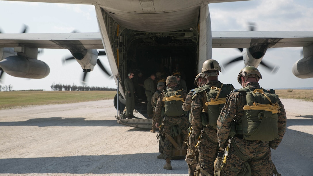 Recon Marines load onto a KC-130J Super Hercules aircraft during parachute training Nov. 20, 2014 on Ie Shima Training Facility, off the northwest coast of Okinawa, Japan. The ability to jump from aircraft and accurately land in a drop zone is an insert asset essential to recon Marines. The Marines are with 3rd Reconnaissance Battalion, 3rd Marine Division, III Marine Expeditionary Force. 