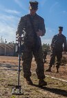 Lance Cpl. Christopher J. Dubay, a motor transport operator with Alpha Company, 2nd Transportation Support Battalion, 2nd Marine Logistics Group, searches for buried plastics and metals, simulating explosives, with a mine detector during counter improvised explosive device training aboard Camp Lejeune, N.C. Marines with 2nd TSB conducted the exercise to improve readiness, unit cohesion and maintain their skills for future deployments. (U.S. Marine Corps photo by Cpl. Joshua W. Brown/Released)
