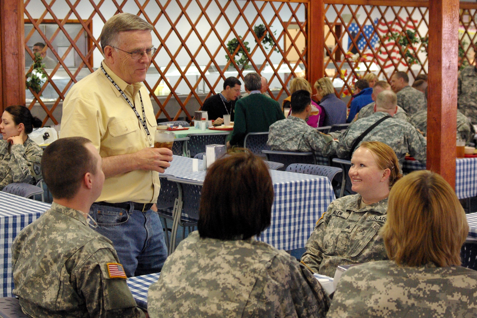 North Dakota Sen. Byron Dorgan talks with a group of North Dakota National Guardsmen, including Sgt. Jessie Allen during a visit to Camp Bondsteel, Kosovo, on April 4, 2010.