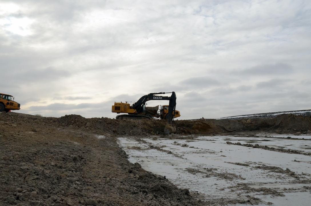 Working up to seven days a week, excavators move 50,000 to 70,000 cubic yards of material a week as contractors work through the winter months to complete the Roseau, Minnesota, flood risk management project.