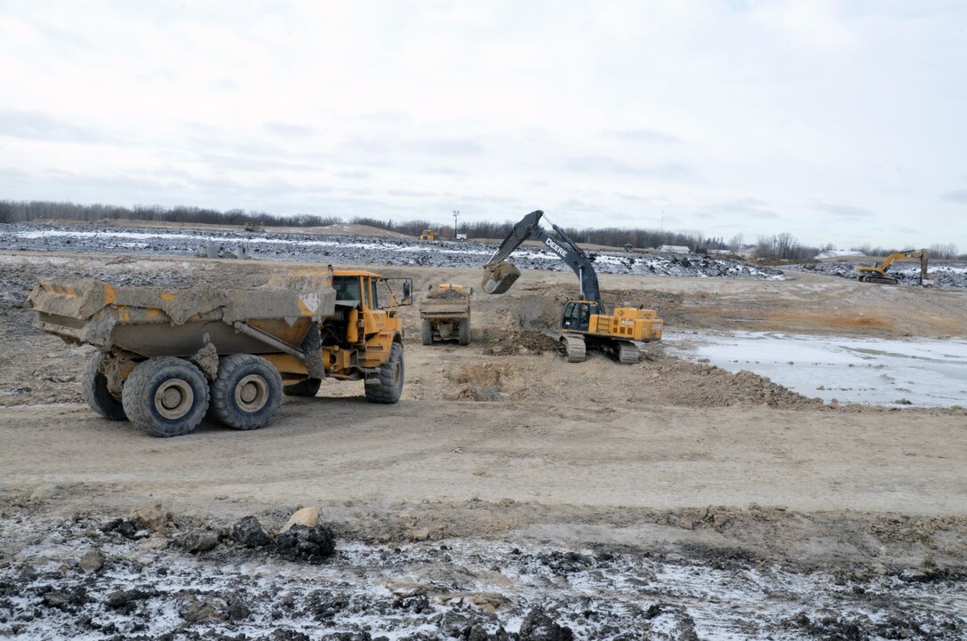 Working up to seven days a week, excavators move 50,000 to 70,000 cubic yards of material a week as contractors work through the winter months to complete the Roseau, Minnesota, flood risk management project.