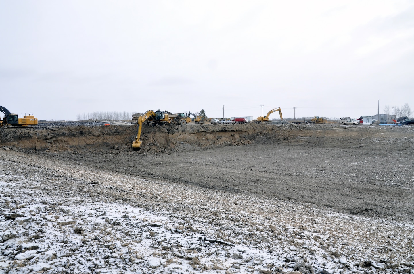 Working up to seven days a week, excavators move 50,000 to 70,000 cubic yards of material a week as contractors work through the winter months to complete the Roseau, Minnesota, flood risk management project.