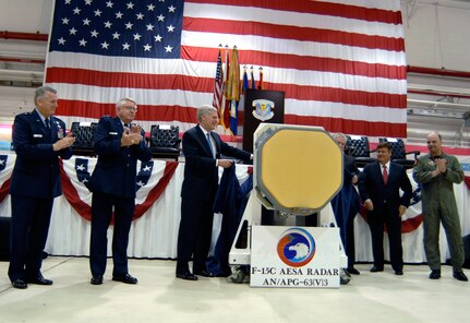 Congressman Ander Crenshaw (center) helps unveil the new APG-63(v)3 Active Electronically Scanned Array during a rollout ceremony at the 125th Fighter Wing in Jacksonville, Fla., April 12, 2010. Flanked by Air National Guard leaders - including the Adjutant General of Florida Maj. Gen. Douglas Burnett (second from left) - and representatives from Boeing and Raytheon, the congressman helped introduce the upgrade for the National Guard's F-15 Eagle fighter aircraft.