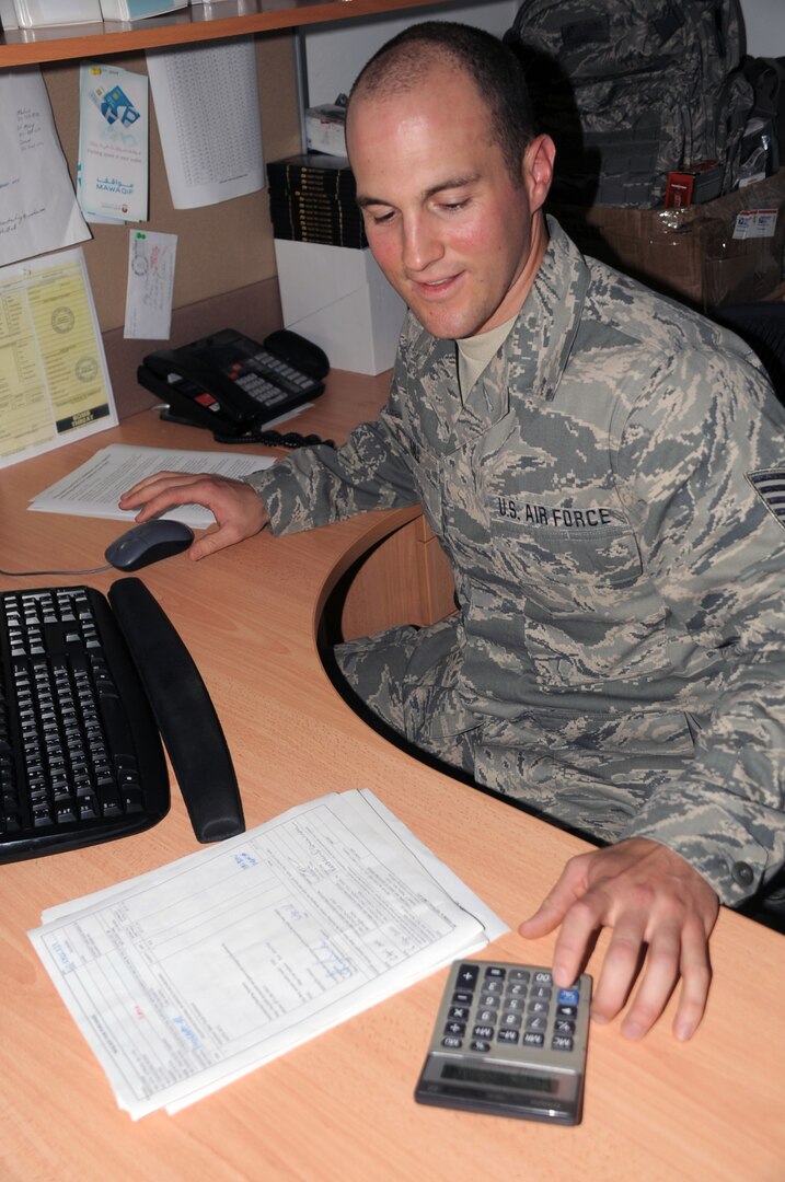 Tech. Sgt. Tyson Hall, a contracting officer with the 380th Expeditionary Contracting Squadron, works in his office in Southwest Asia, April 8, 2010. He is deployed from the Wisconsin Air National Guard's 115th Fighter Wing at Truax Field in Madison.